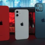 a picture of three iphones on top of a desk