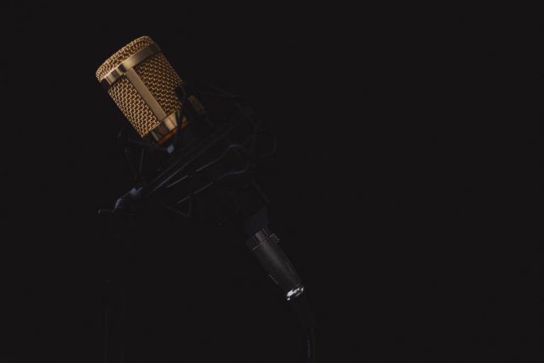 a studio microphone with dark background